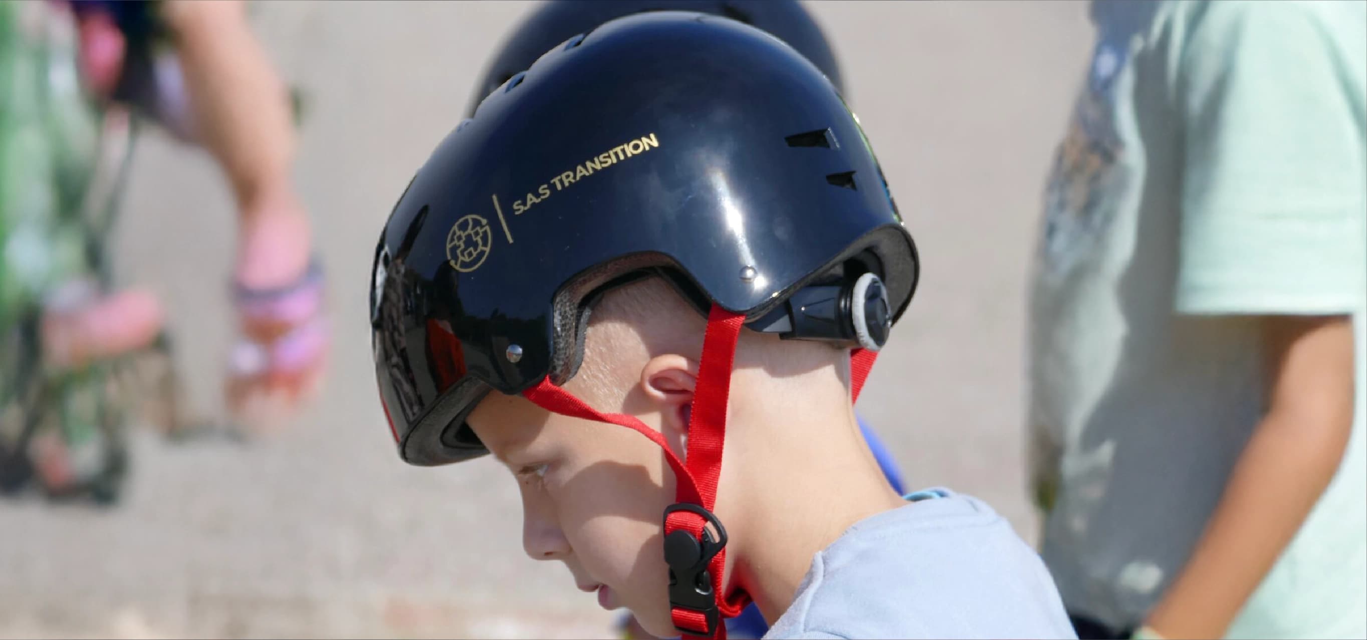 Young person wearing skateboarding helmet